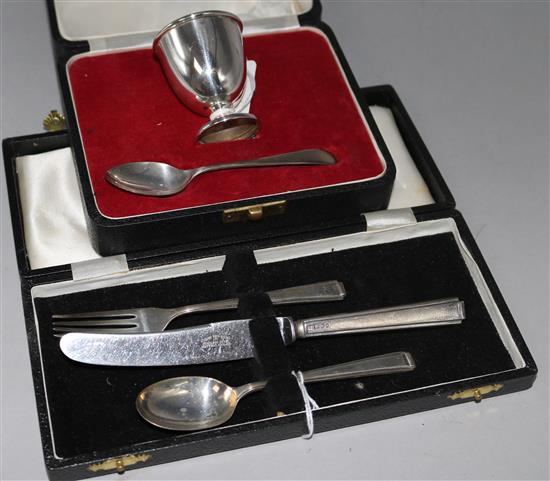 Two cased silver christening sets.